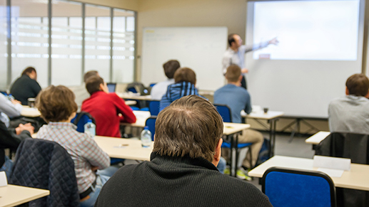 Classroom of people watching an instructor